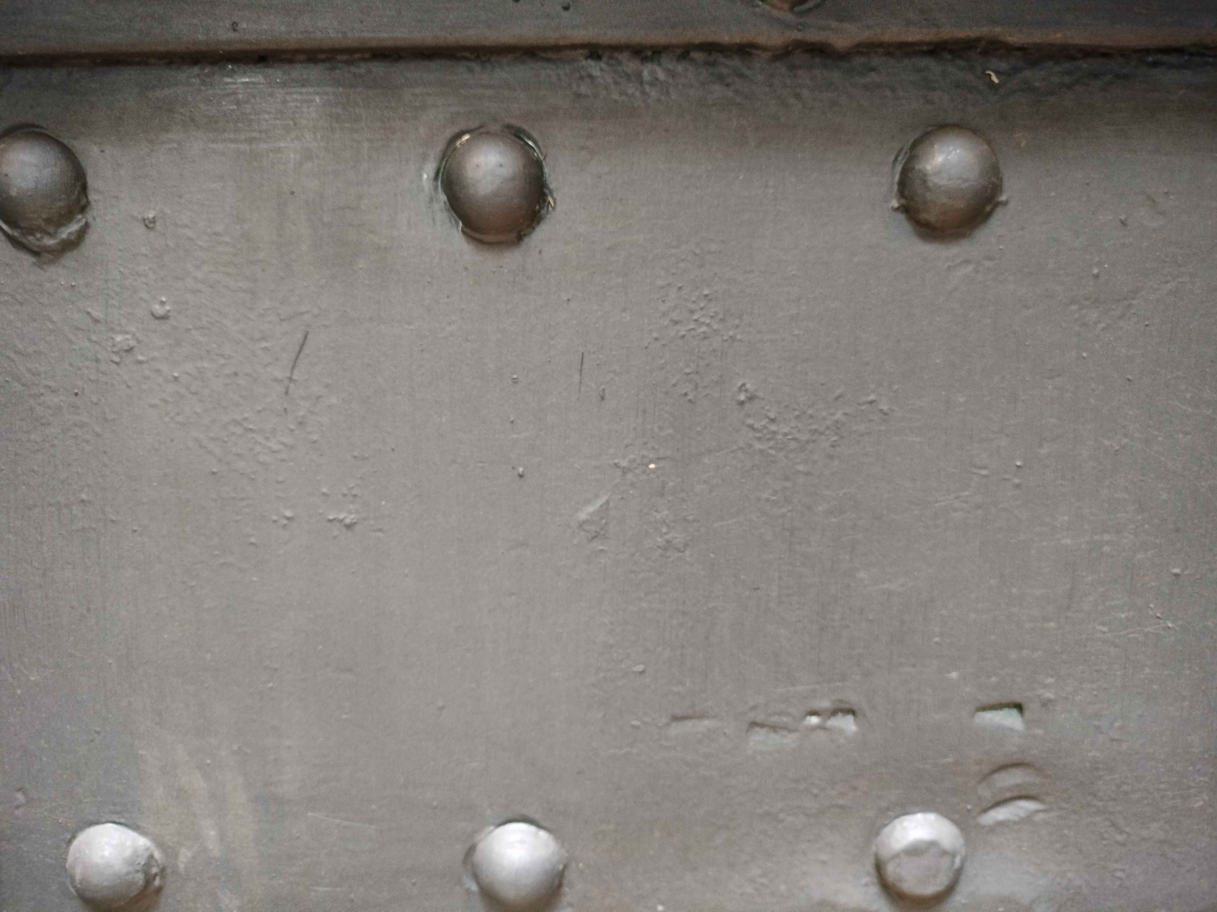 Metal Coveted With Screws